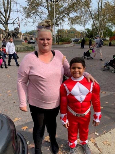 mom with her son dressed as a superhero